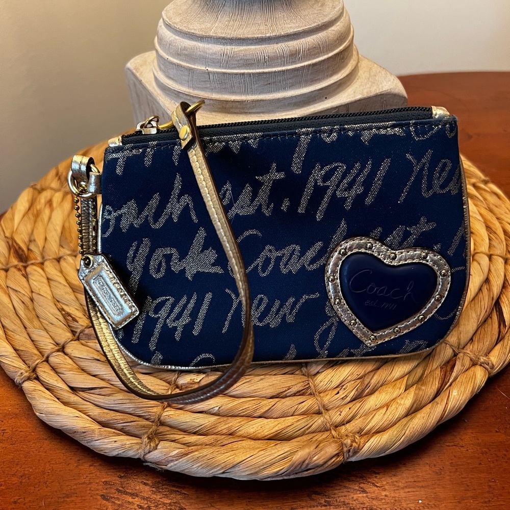 Cute Navy & gold coach wristlet.  In great condition, smoke free home.  No flaws